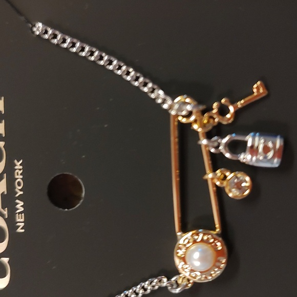 Nwt ladies Coach 2 toned safety pin necklace with charms - Picture 3 of 5